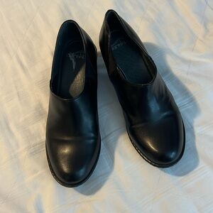 Dansko dress clogs.  Slight heel.